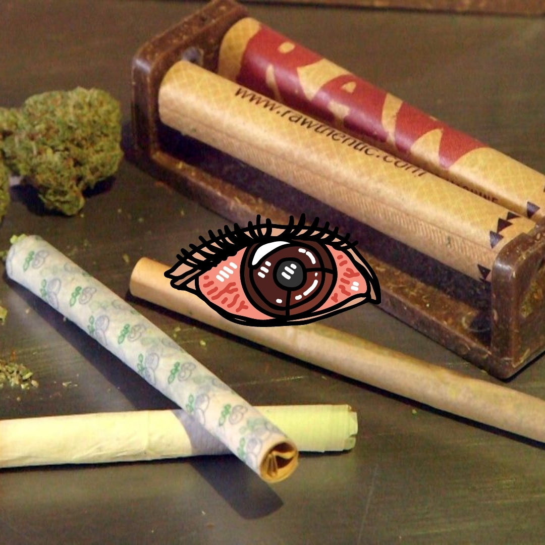 rolling a joint with dry herb around on the table with animation of red eyes